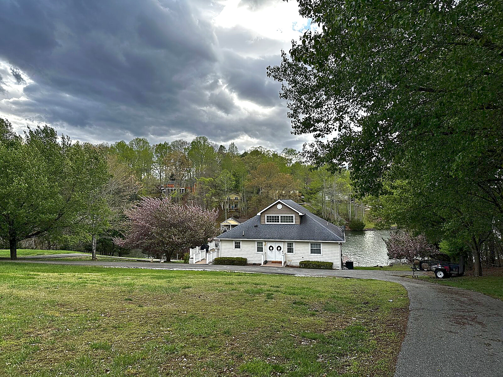 Beaches Be Salty lake house viewed from the sloping lawn above Smith Mountain Lake